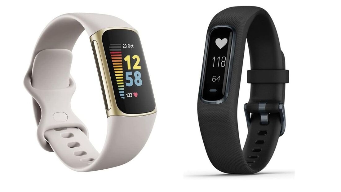 A close-up comparison of a Fitbit Charge 5 and a Garmin Vivosmart 4 side-by-side