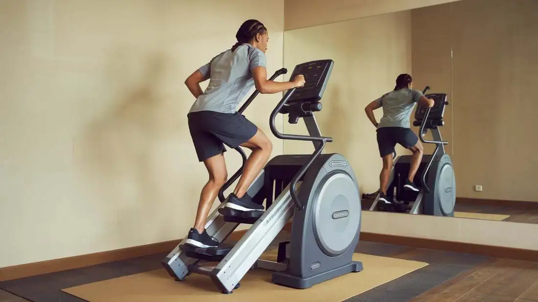 A motivated person using a stair climber, showcasing great form and intensity