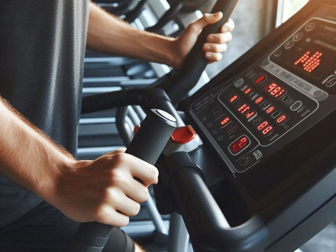 A person using an elliptical trainer with a high resistance setting