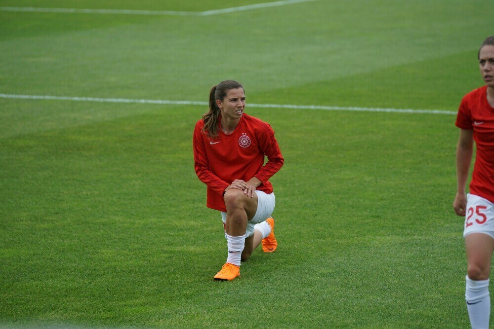 A woman warming up before the game