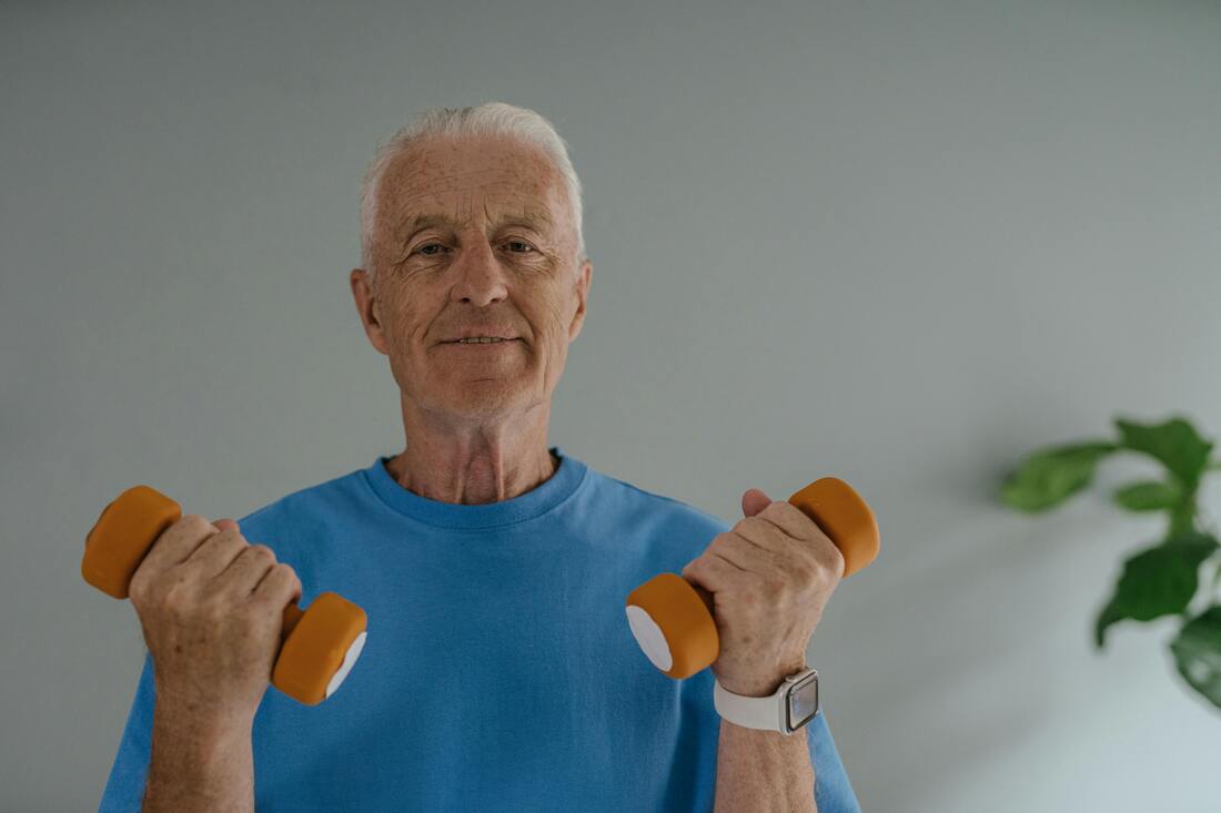 An Elderly Man doing Dumbbells exercise