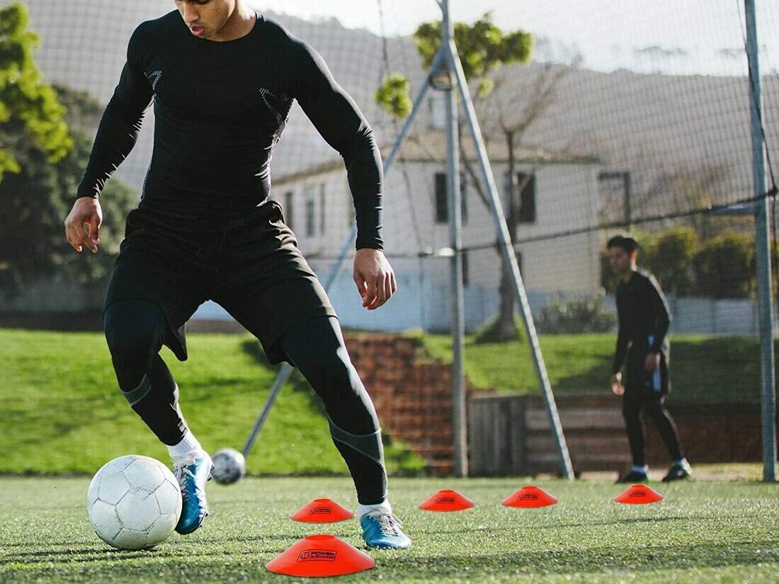 Athlete performing footwork drills on agility ladder