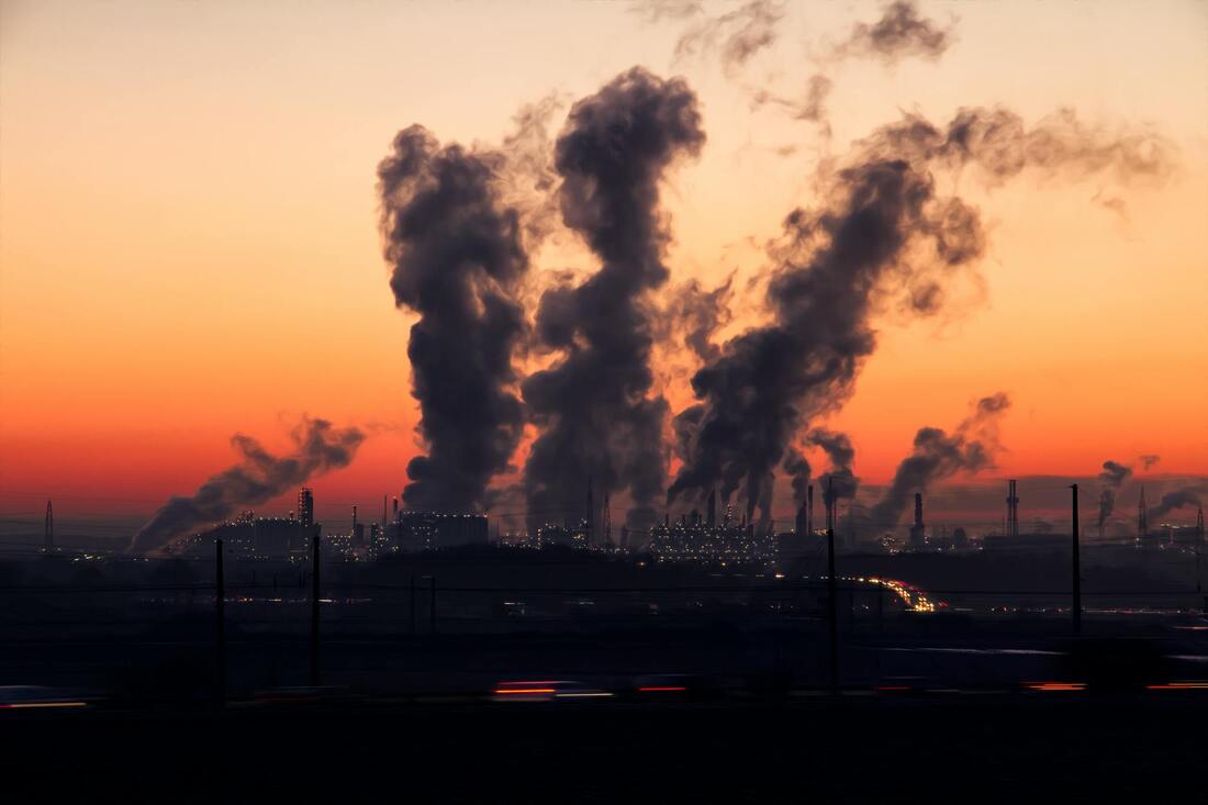 City skyline with smog or factory smoke stacks