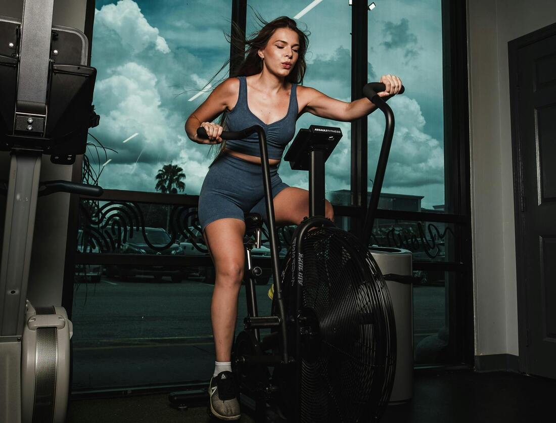 Close-up photo of someone using an elliptical trainer with proper form