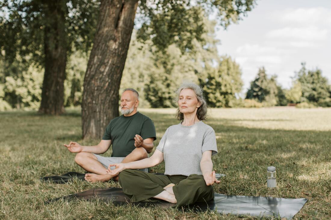 Couple doing yoga breathing exercise