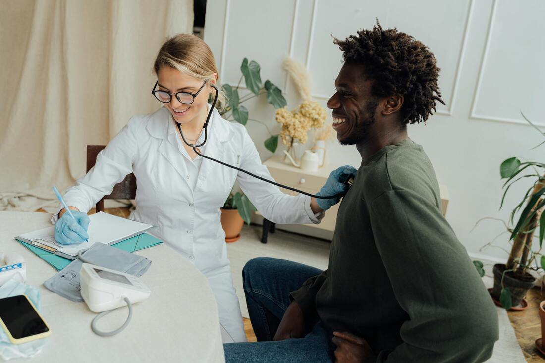 Doctor using a stethoscope to listen to a patient's lungs