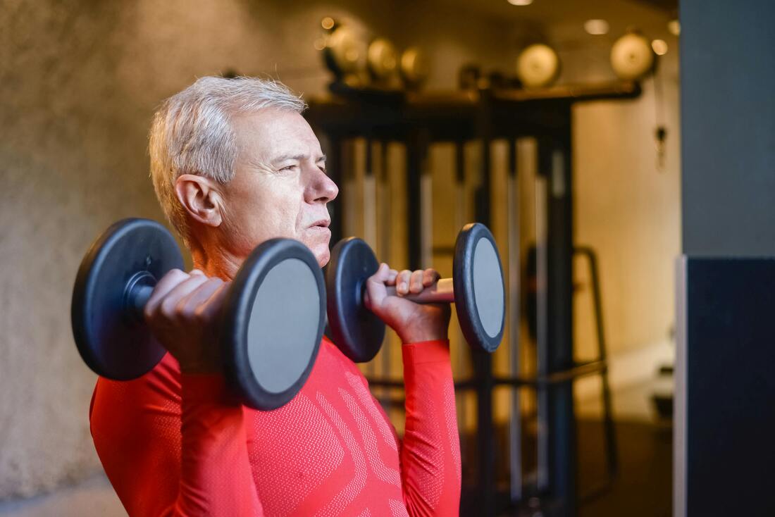 Elderly Man Lifting Dumbbells for exercise