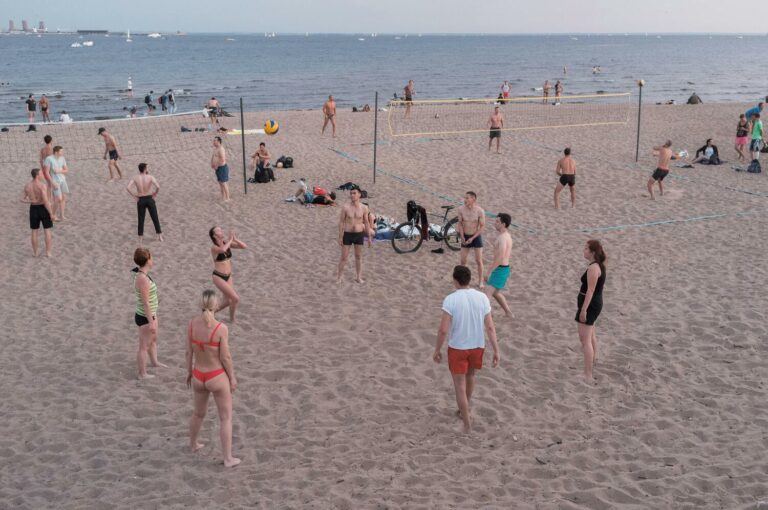 Groups of People Playing Beach Volleyball