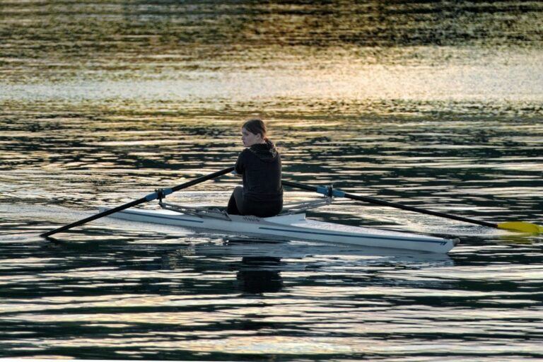 A person with good form rowing with nature