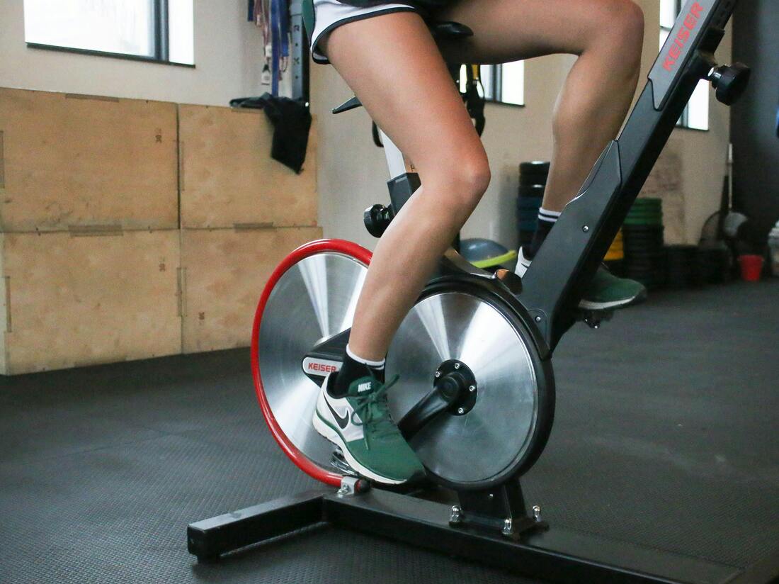 Person riding a gym bike at home