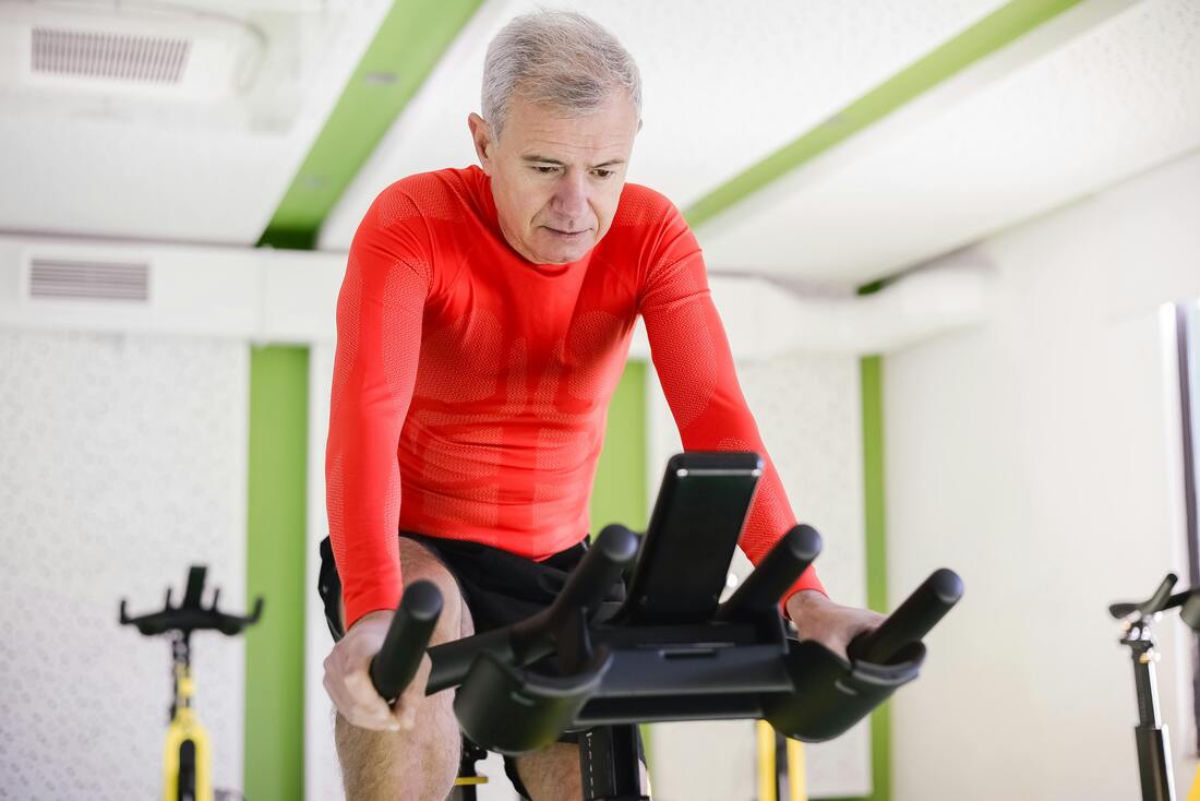 Person riding a spin bike at home