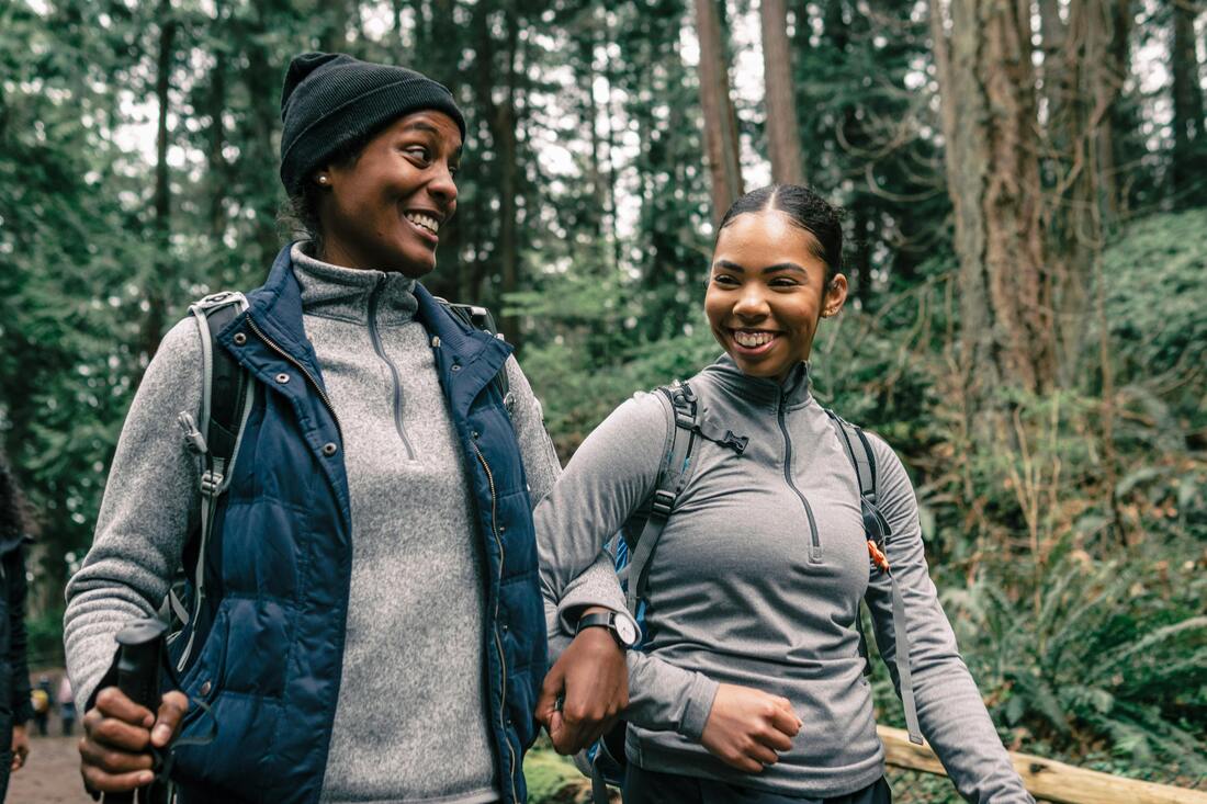 Persons laughing and enjoying an outdoor activity