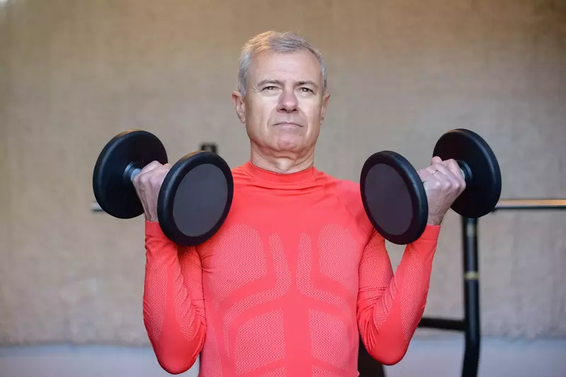 Senior man with weights