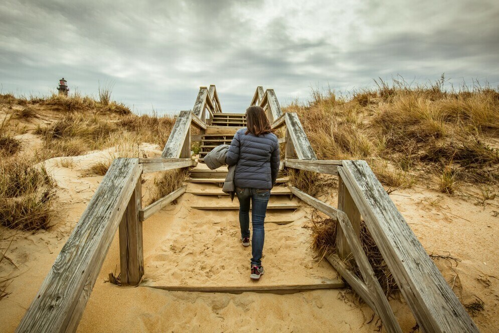 a woman confidently walking or climbing stairs