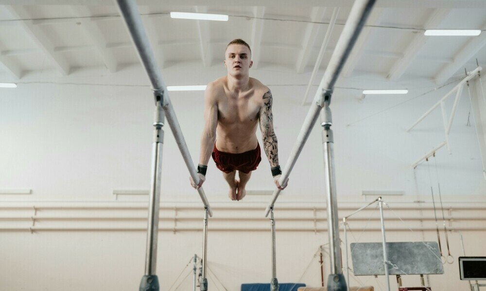 an image of an acrobat demonstrating excellent balance