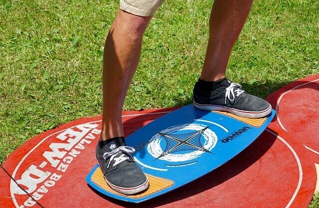 Senior using a balance board